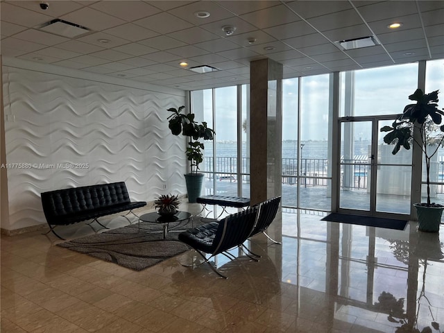 community lobby featuring visible vents and a water view