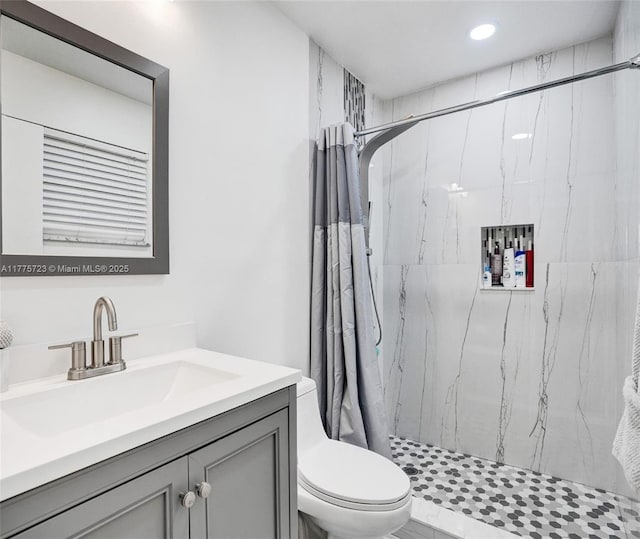 217 SE 5th St, Dania Beach, FL 33004 - full bathroom featuring toilet, a marble finish shower, vanity, and recessed lighting