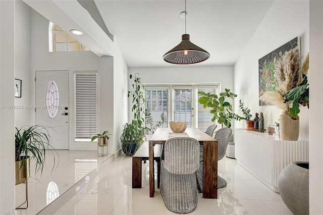 dining space with light tile patterned floors