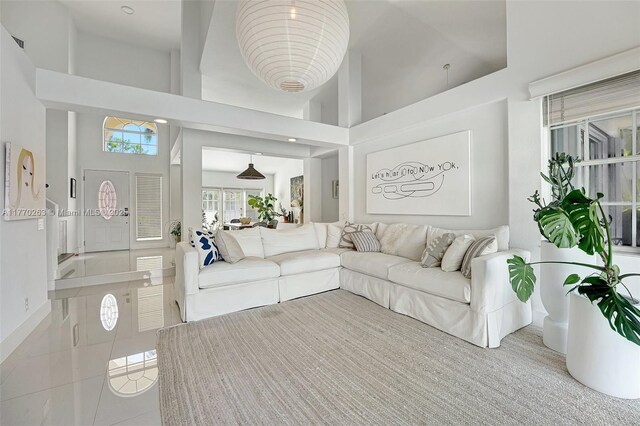 1055 San, Luis Rey, Weston, FL 33326 - tiled living room featuring a towering ceiling
