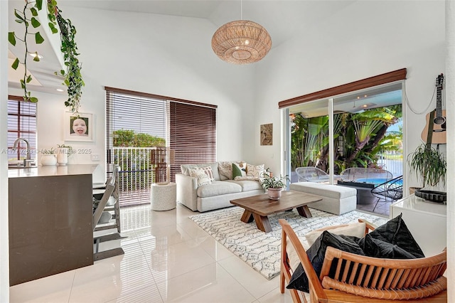 living room with tile patterned floors and a towering ceiling
