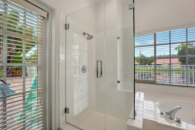 1055 San, Luis Rey, Weston, FL 33326 - bathroom featuring a stall shower and a bath