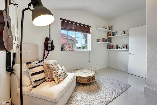 living area with tile patterned flooring and lofted ceiling