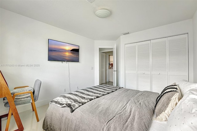 bedroom featuring a closet and visible vents