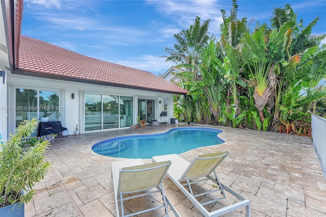 outdoor pool with a patio