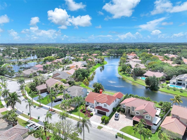 bird's eye view featuring a residential view and a water view