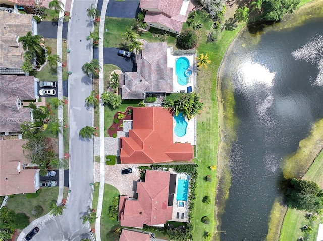birds eye view of property with a water view