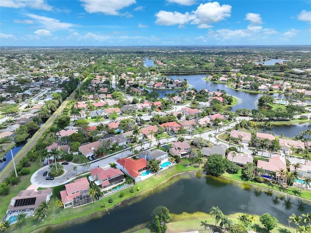 drone / aerial view with a residential view and a water view