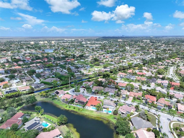 birds eye view of property featuring a water view and a residential view