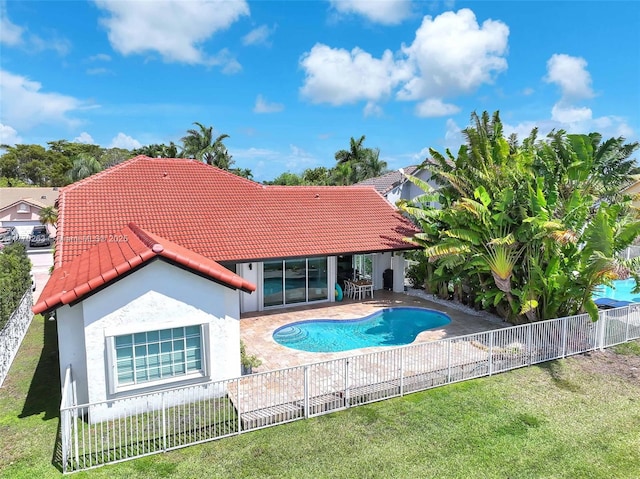 view of pool with a fenced in pool, a fenced backyard, a yard, and a patio