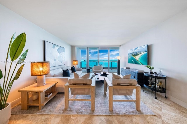 1331 Brickell Bay Dr Unit 3305, Miami, FL 33131 - living area featuring a wall of windows and baseboards
