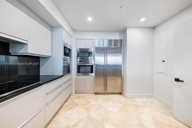 1331 Brickell Bay Dr Unit 3305, Miami, FL 33131 - kitchen featuring black appliances, white cabinets, exhaust hood, recessed lighting, and electric panel