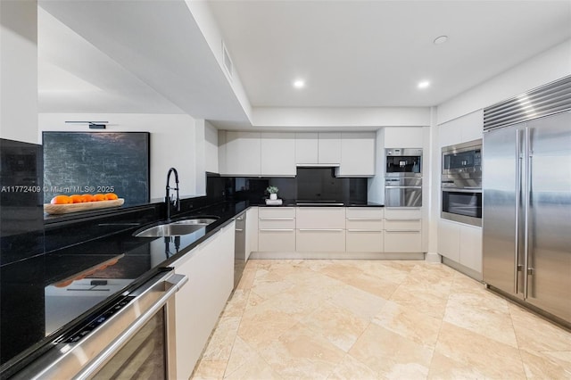 1331 Brickell Bay Dr Unit 3305, Miami, FL 33131 - kitchen with built in appliances, white cabinetry, tasteful backsplash, modern cabinets, and recessed lighting