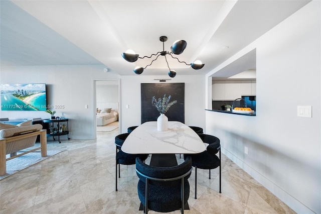 1331 Brickell Bay Dr Unit 3305, Miami, FL 33131 - dining area featuring a chandelier and light marble finish flooring