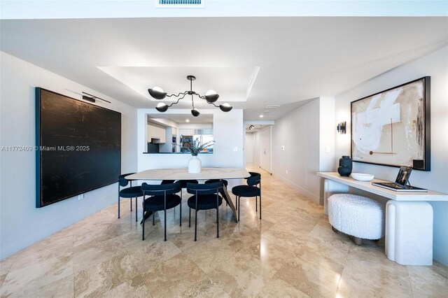 1331 Brickell Bay Dr Unit 3305, Miami, FL 33131 - dining space featuring a chandelier and a raised ceiling