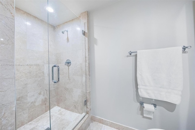 1331 Brickell Bay Dr Unit 3305, Miami, FL 33131 - bathroom featuring a shower stall and tile patterned flooring