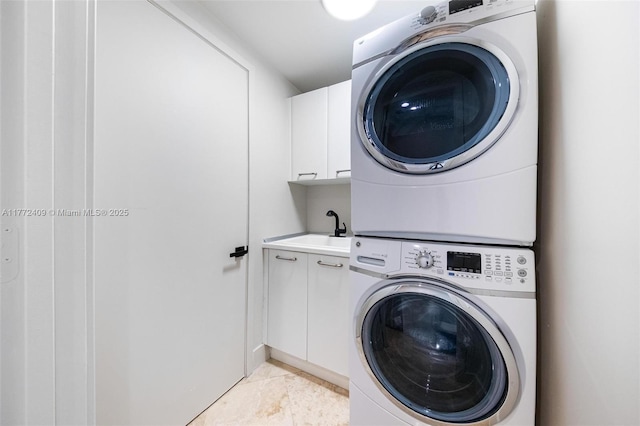 1331 Brickell Bay Dr Unit 3305, Miami, FL 33131 - washroom with estacked washer and dryer and cabinet space