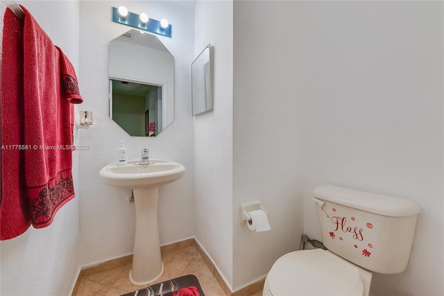 bathroom featuring toilet and tile patterned floors