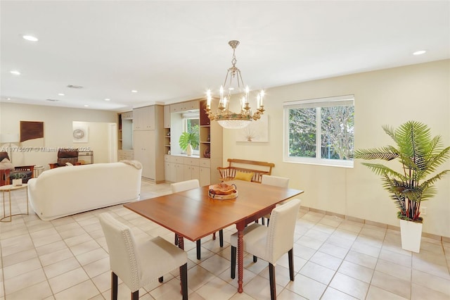 dining space featuring recessed lighting and a notable chandelier