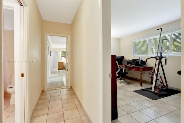 hallway featuring light tile patterned flooring