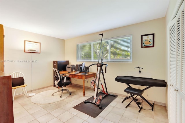 tiled home office featuring baseboards