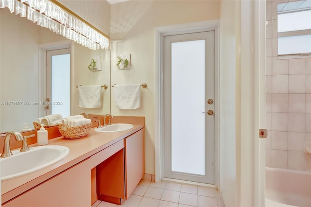 full bathroom with tile patterned floors, a sink, and double vanity