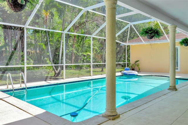 pool featuring a lanai and a patio