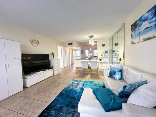 living room with visible vents and light tile patterned floors