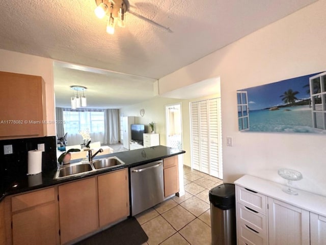 1893 S Ocean Dr Unit 903, Hallandale Beach, FL 33009 - kitchen featuring dishwasher, light tile patterned floors, a sink, and dark countertops
