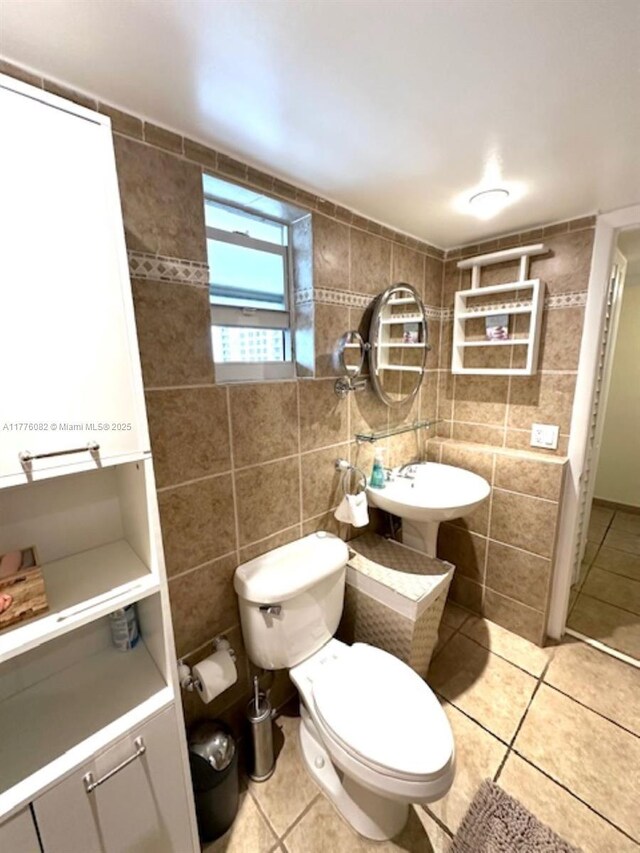 1893 S Ocean Dr Unit 903, Hallandale Beach, FL 33009 - bathroom with tile patterned floors, toilet, and tile walls