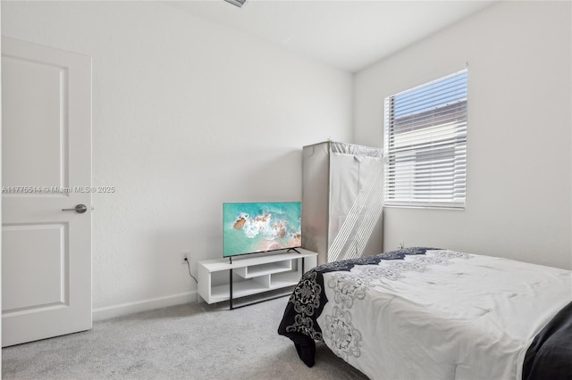 bedroom featuring baseboards and carpet flooring