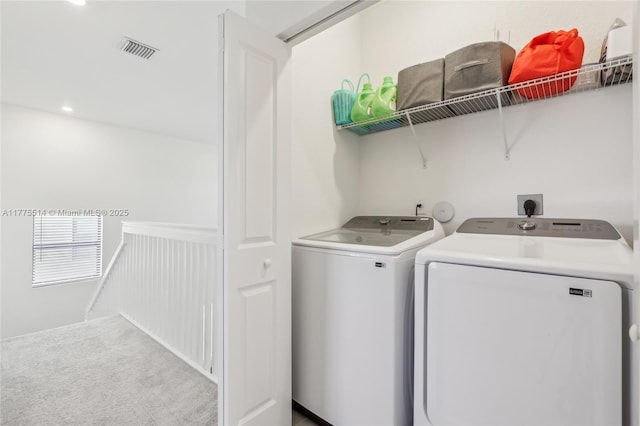 laundry area with recessed lighting, washing machine and clothes dryer, laundry area, visible vents, and carpet floors