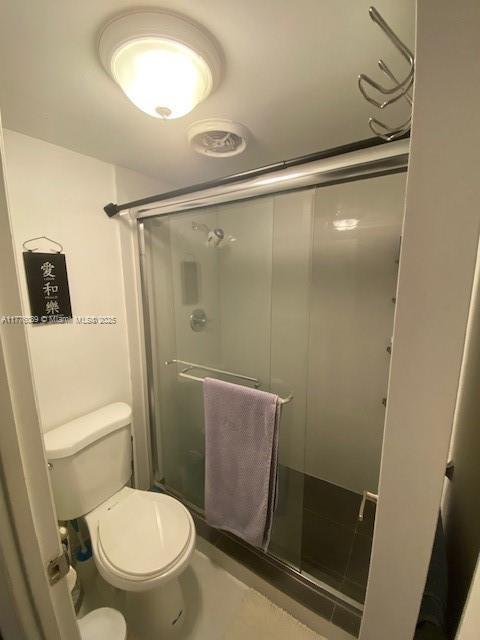 401 SE Golden Isles Dr Unit 712, Hallandale Beach, FL 33009 - bathroom featuring a shower stall and toilet