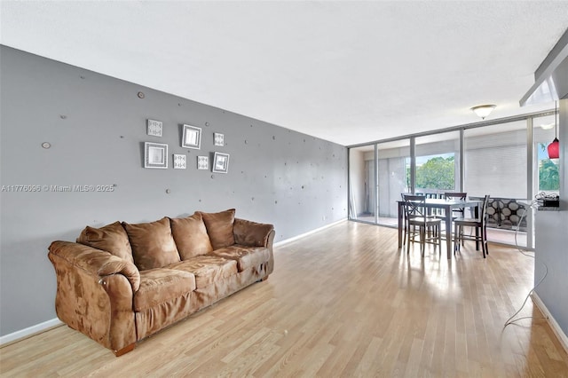 6911 Environ Blvd Unit 3L, Lauderhill, FL 33319 - living area with light wood-style floors and baseboards