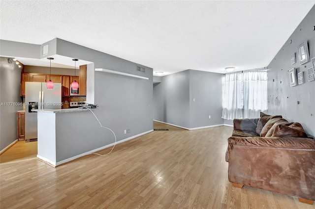 6911 Environ Blvd Unit 3L, Lauderhill, FL 33319 - living room with light wood finished floors and baseboards