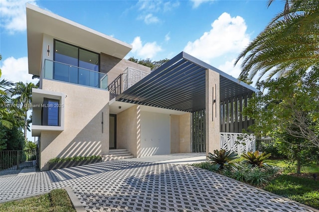 5825 Alton Rd, Miami Beach, FL 33140 - view of front of property featuring a balcony and stucco siding