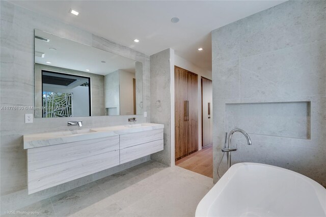 5825 Alton Rd, Miami Beach, FL 33140 - full bath with a freestanding bath, double vanity, and a sink
