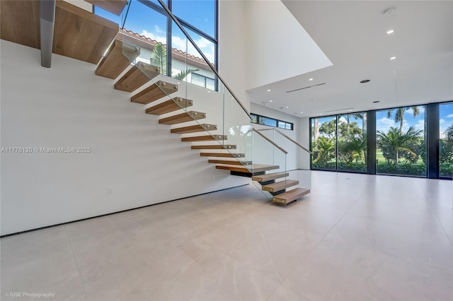 5825 Alton Rd, Miami Beach, FL 33140 - stairway with a towering ceiling, floor to ceiling windows, and recessed lighting