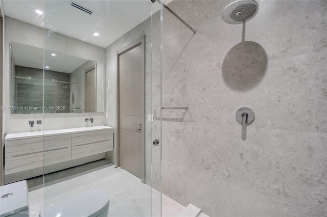 5825 Alton Rd, Miami Beach, FL 33140 - full bathroom with a tile shower, toilet, double vanity, and visible vents