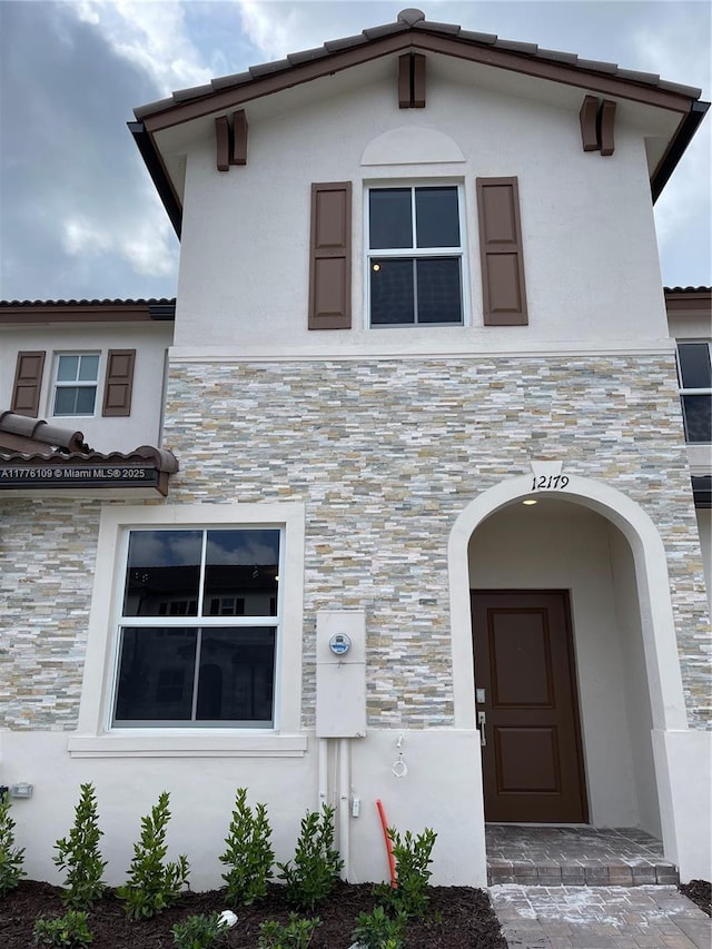 12179 NW 23rd Ct, Miami, FL 33167 - view of front facade with stone siding and stucco siding