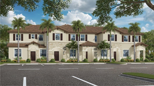 12179 NW 23rd Ct, Miami, FL 33167 - view of front facade with stone siding, stucco siding, a tiled roof, and uncovered parking
