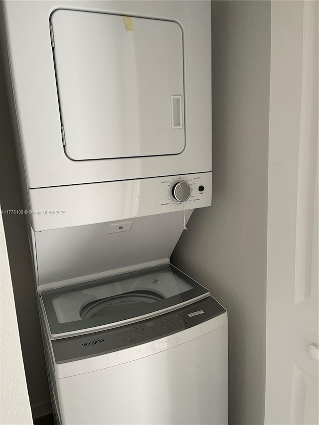12179 NW 23rd Ct, Miami, FL 33167 - laundry area with stacked washing machine and dryer
