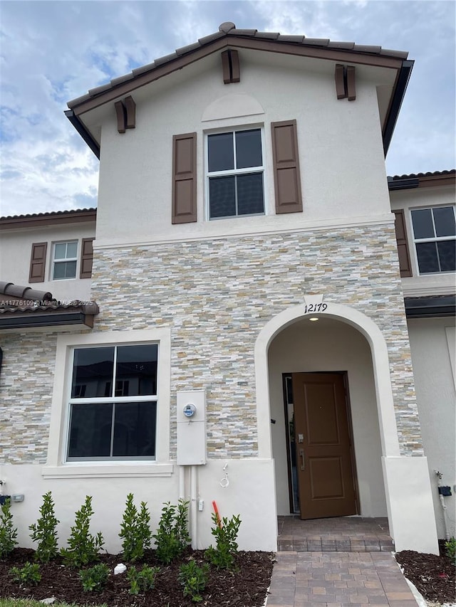12179 NW 23rd Ct, Miami, FL 33167 - view of front of house featuring stone siding and stucco siding