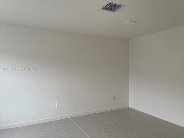 12179 NW 23rd Ct, Miami, FL 33167 - tiled spare room featuring baseboards
