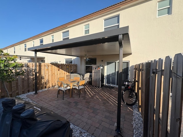 12179 NW 23rd Ct, Miami, FL 33167 - fenced backyard with outdoor dining area and a patio