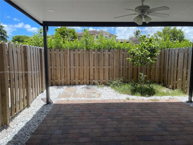 12179 NW 23rd Ct, Miami, FL 33167 - fenced backyard featuring ceiling fan and a patio