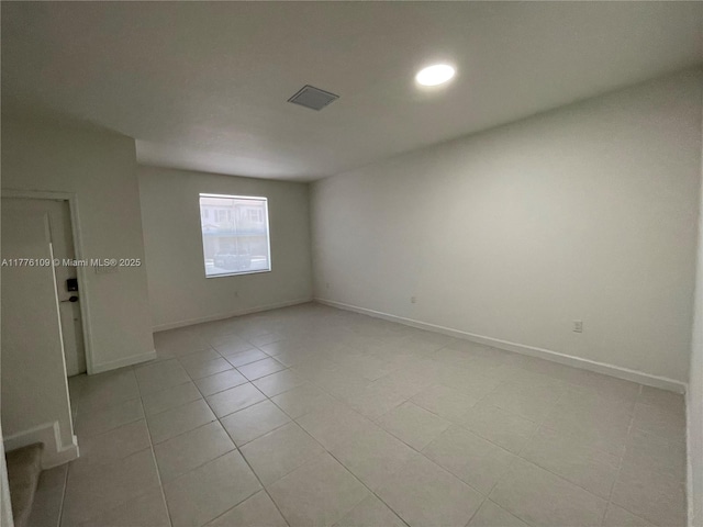 12179 NW 23rd Ct, Miami, FL 33167 - unfurnished room with light tile patterned flooring and recessed lighting