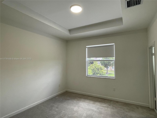 12179 NW 23rd Ct, Miami, FL 33167 - carpeted empty room with baseboards and a raised ceiling