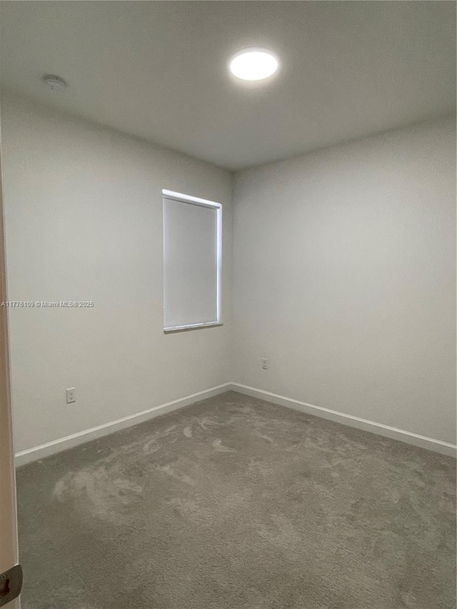 12179 NW 23rd Ct, Miami, FL 33167 - empty room with dark carpet and a smoke detector
