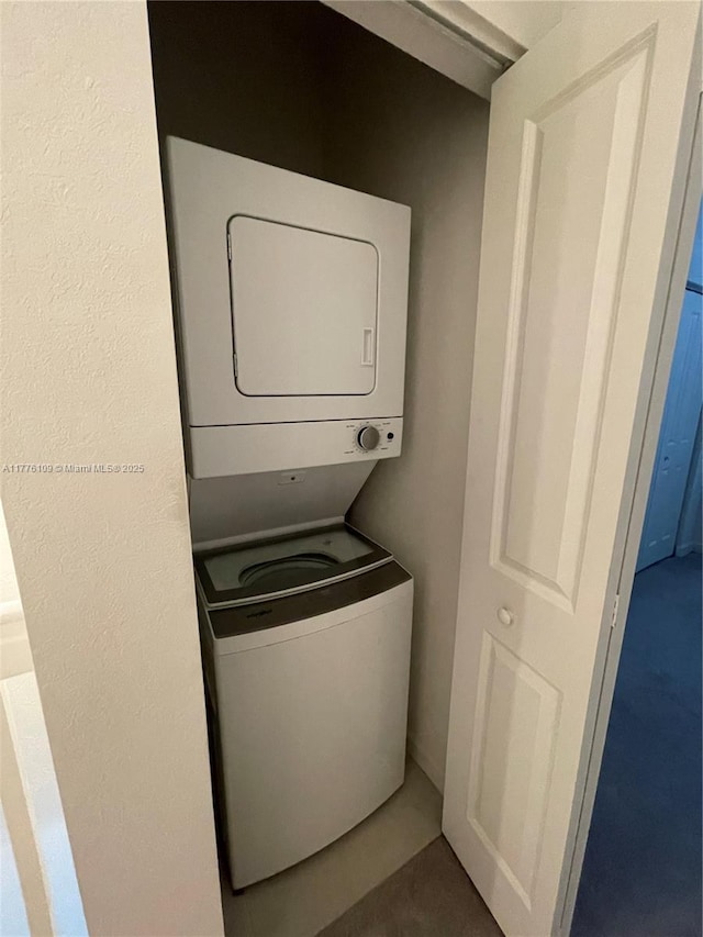 12179 NW 23rd Ct, Miami, FL 33167 - laundry room featuring estacked washer and dryer